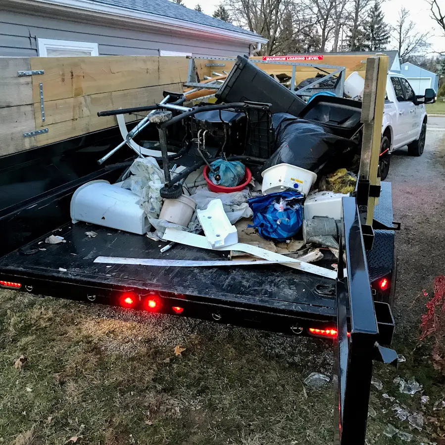 Roll-off dumpster delivered to a residential driveway in Arab